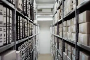 corner inner view of 3PL warehouse, shows stored items and cartons || tips for new e-commerce