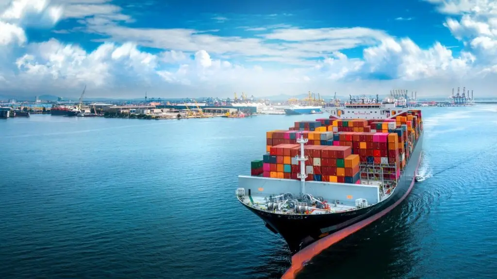 Aerial side view of cargo ship carrying container and running for export-sea freight by GHSL